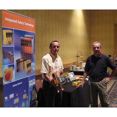 B&R technology director Robert Muehlfellner (left) discusses openSAFETY and their company's line of safety systems over a singl