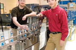 PACKML-COMPLIANT. P&G engineers Jason DeBruler (left) and Dan Amundson.
