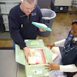 Packaging vaccines. Dr. Suzet McKinney talks with CDPH staff about handling of the H1N1 vaccine as the staff packs Greenbox cont