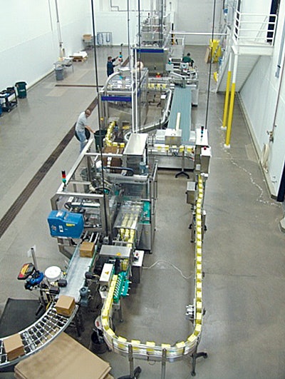 After the aseptic cartons emerge from the filling machine, they are collated and then sent through a case packaging system.