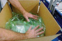 DISPENSING UNITS. Five dispensing units like the one shown on the left are mounted on a mezzanine level over the packing statio