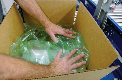 DISPENSING UNITS. Five dispensing units like the one shown on the left are mounted on a mezzanine level over the packing statio