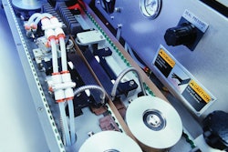 band sealer. Pictured is the interior of the B-500 continuous hand sealer with its heating and cooling bars and Teflon bands.