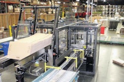 MAGAZINE FEED. Photo above shows knocked-down corrugated cases stacked in a magazine feed on the left and product infeed on the