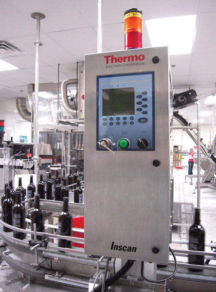 ROTARY FILLER. The new 54-head rotary filling system (left) can handle hot or cold filling, and its design has greatly simplifie