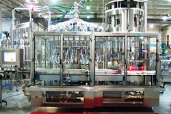 An 18-head, 36-axis dual phase rotary servo filler (left in this view of monobloc filler-capper) from PneumaticScaleAngelus.