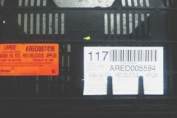 A reusable plastic containers (RPC) with the affixed RFID tag (mounted behind the orange label).