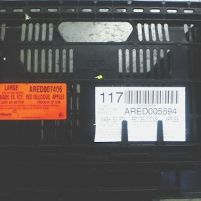 A reusable plastic containers (RPC) with the affixed RFID tag (mounted behind the orange label).