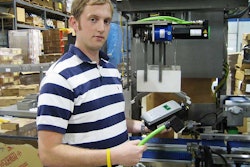 Goodman's Kurt Larson holds one of ELAU's PacDrive Intelligent Servo Modules and its unique, quick-connect cable. A conventiona
