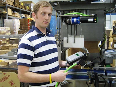 Goodman's Kurt Larson holds one of ELAU's PacDrive Intelligent Servo Modules and its unique, quick-connect cable. A conventiona
