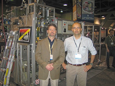ICA's Gregg Pascoe and Dr. Giulio Evangelisti at the SCAA conference with the high performance CSV40 Paket bagging systems sold