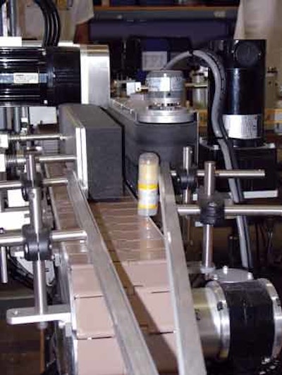 LABEL APPLICATION. The new labeler applies labels to Body Butter containers at speeds of approximately 30 per minute.
