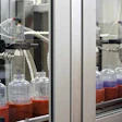 two-station filling. Containers are held in pucks as they are conveyed single-file through the packaging line. Volumetric fillin