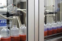 two-station filling. Containers are held in pucks as they are conveyed single-file through the packaging line. Volumetric fillin