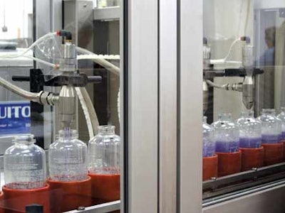 two-station filling. Containers are held in pucks as they are conveyed single-file through the packaging line. Volumetric fillin