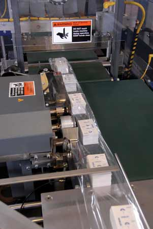 FILM SAVINGS. Rotary side seal on the stretch wrapper lets BP&I use rolls of film that are 2 ' narrower than what's required for