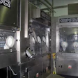 ISOLATOR CHAMBER. Sterilization, rinsing, filling, and capping are all conducted inside this microbiological isolator chamber.