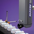 Laser coder. A laser coder marks a carton containing a solid-dose pharmaceutical product.