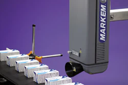 Laser coder. A laser coder marks a carton containing a solid-dose pharmaceutical product.