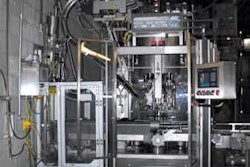 ROTARY CAPPER. This eight-head capper feeds ROPP closures from a hopper onto the bottles and uses a pressure block inside each