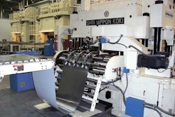 COIL-TO-CAN TECHNOLOGY. Steel is fed from a coil unwind stand into a cupping press (above) that transforms the flat coil into la