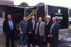 Niaz Latif, with some members of PUC advisory board show off the new School of Technology mobile van.