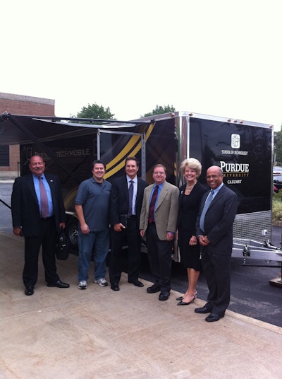 Niaz Latif, with some members of PUC advisory board show off the new School of Technology mobile van.