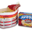 The package's tear-away film lid and outer folding carton.