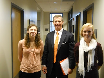 Pictured with Grace Cook (left) and Mackenzie Lussier (right) is Dennis Love, president and CEO of Printpack.