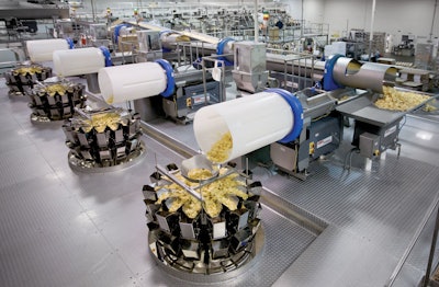 Four baggers on the ground floor are fed by these weighers on a mezzanine level.