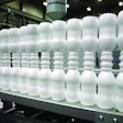 Liquid yogurt containers are extrusion blown neck-to-neck.