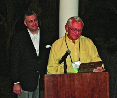 Donley accepts plaque, joined by Joe Jaruszewski, president of CPA and of Market Resource Packaging.