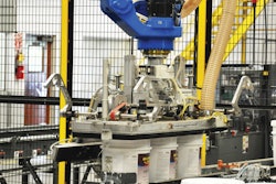Custom end-of-arm tooling for the robot arm at Kelly-Moore’s facility.