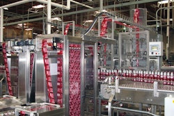 Both heads of the tandem shrink-sleeve labeler have a film accumulation feature that makes it possible to splice in a new roll of film with no interruption to labeling.