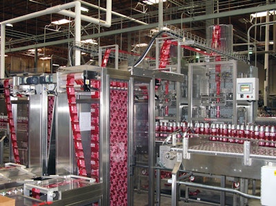 Both heads of the tandem shrink-sleeve labeler have a film accumulation feature that makes it possible to splice in a new roll of film with no interruption to labeling.