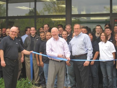 Chuck Edwards, President, Lenze Americas and Gene Wood, dir. of operations, Lenze Americas, appear at the ribbon cutting for the grand opening of its new Chicagoland facility.