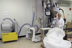 Operators use a large vacuum want to evacuate product from the bulk sacks.