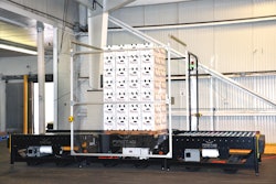 Viewed from the side, the pallet is in the central station of the three-station FireTag system; infeed is to the right and discharge to the left.