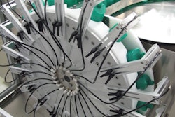 Shortly after HDPE bottles have been unscrambled and oriented on Doppel’s new liquids line, the bottles are inverted and cleaned with a burst of purified air.