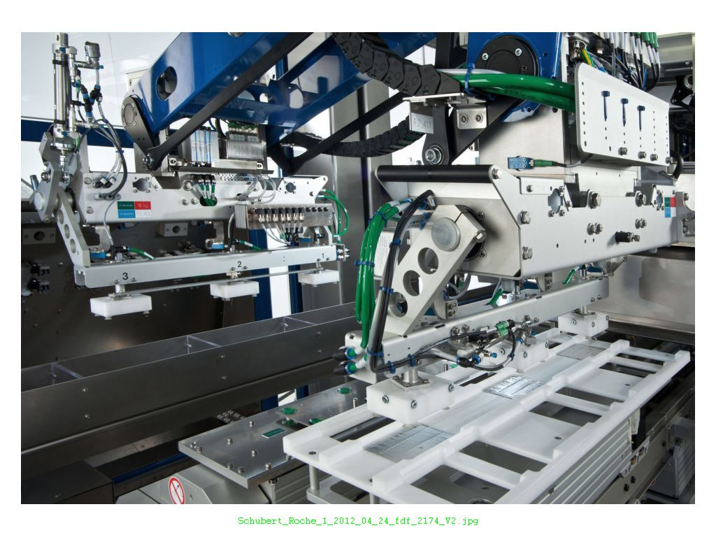 Top loading machine places blisters online.