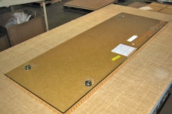 1. Glass panel is placed on 1-in. piece of honeycomb, cut slightly larger than the glass.