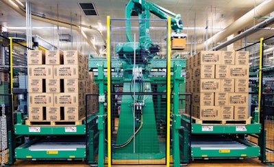 TWO PALLETS. Each of Lorillard’s 16 robotic palletizers is fed by two packaging lines, with the robot building two pallets at one time corresponding to the two lines.