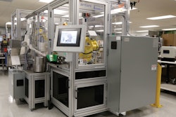 FRONT VIEW. The front of the AFTCATS robotic bottling system shows the main touchscreen display, with the pick-and-place loading robot shown in the window.