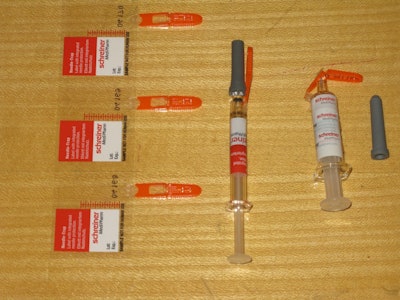 Schreiner-Medipharm's Needle-Trap. It’s a pressure-sensitive label solution for syringes that addresses the problem of sharps. Included here is a photo of (from left to right) three labels still on their release liner, a freshly labeled syringe with its protective needle sheath in place, and a post-injection syringe with its needle safely trapped in plastic with no opportunity whatsoever for harm to healthcare personnel. All that’s left is disposal into the nearest sharps container. According to Schreiner M
