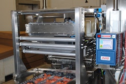 CUSTOM FIT. Housed in a compact, custom-engineered frame, the digital thermal transfer printer retrofits nicely to Battistoni’s existing line and codes packages from 6-oz to 5-lb in volume