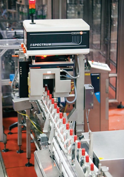 QUALITY INSPECTION. An inspection system immediately following the monobloc rinser/filler/capper on Line 9 (left) inspects the package fill level and cap placement. The same system is also used on Lines 8 and 10.