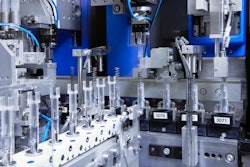 U.S. pharmaceutical firm orders auto injector production. Shown here is the fully automated insertion of a spring into a plastic auto injector component.