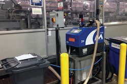 ALL-ELECTRIC. Shown here is one of the seven all-electric hot melt adhesive application systems running at the PepsiCo plant.