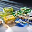 In-mold labeling differentiates this margarine package from Mills.