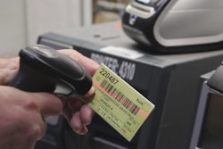 PRINT JOB. A Hypertherm employee initiates a print job through barcode scanning.